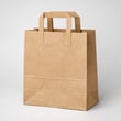 Kraft paper bag with flat bottom and reinforced handles